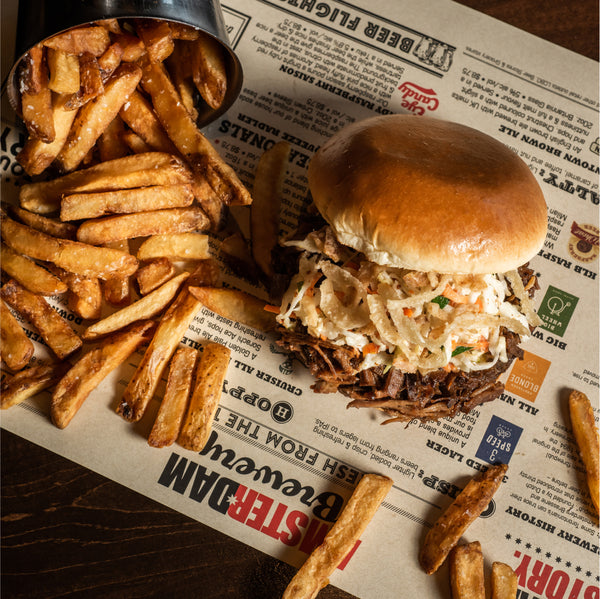 Smoked Brisket Sandwich at Amsterdam Brewhouse, perfect for a rooftop dining experience with lakeside views.