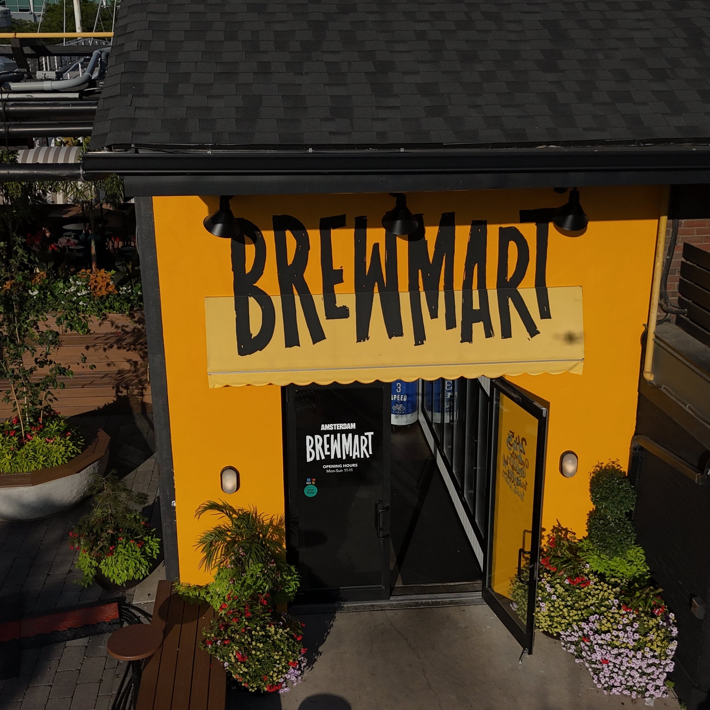 Yellow building with 'Brewmart' sign in an urban setting